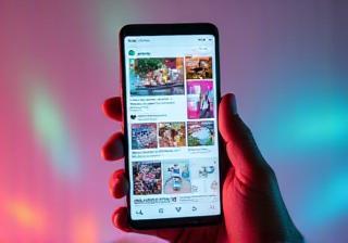 Social media feed displayed on a mobile phone